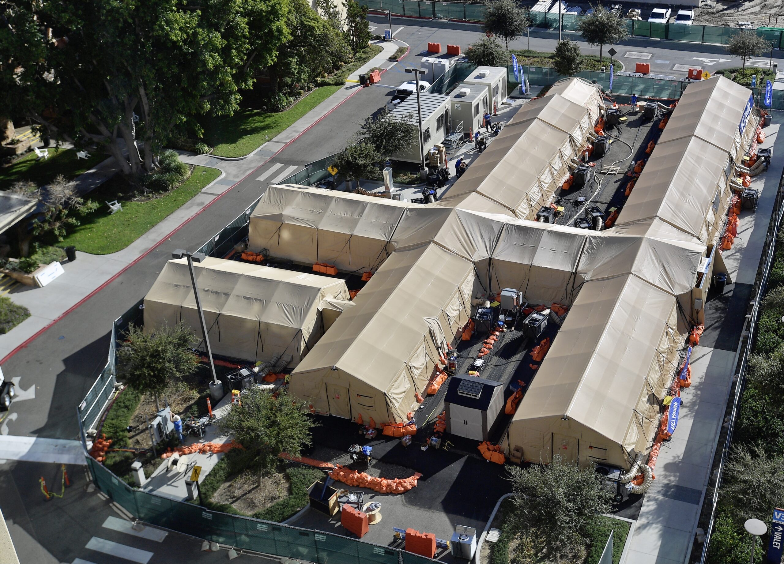 A mobile field hospital in a parking lot at UCI Medical Center on Wednesday, Dec. 30, 2020. The 40-bed tent buildings are designed to take pressure off the main hospital by housing less serious patients.
(Photo by Jeff Gritchen, Orange County Register/SCNG)